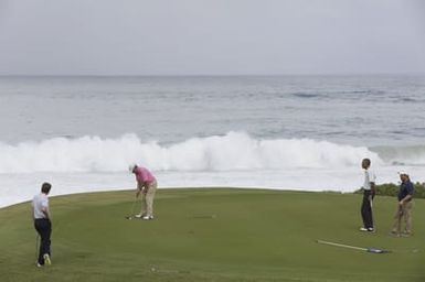 Barack Obama plays golf with Prime Minister Najib Razak, Joe Paulsen, and Mike Brush in Kaneohe Bay, Hawaii, December 24, 2014