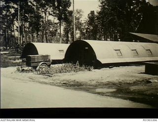 Torokina, Bougainville. 1944-11 to 1945-11. At the base used by No. 1 and No. 3 Section, Detached, 2 Field Survey Company, Nissen Huts taken over from the US Forces are used as drawing offices