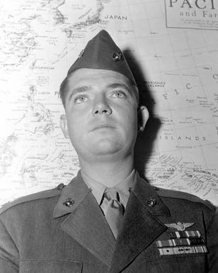 Official Portrait of US Marine Corps (USMC) Major Charles M. Kunz, taken at San Deigo, California (CA). MAJ Kunz has been awarded the Purple Heart and Navy Cross, he is holder of an Air Medal for participating in 56 strikes in the Marshall Islands and also has 2 Presidential Unit Citations and is an Ace Pilot credited with 8 kills