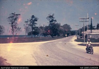 Dirt roads, man on motorcycle, power lines