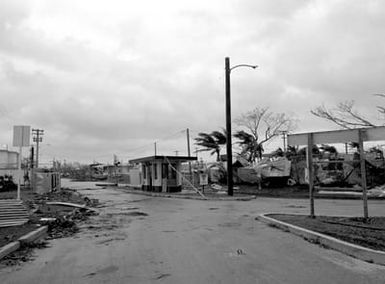 A view of the back gate area at Naval Air Station, Agana, which exhibits some of the damage resulting from Typhoon Omar. The storm passed through the area on August 28th