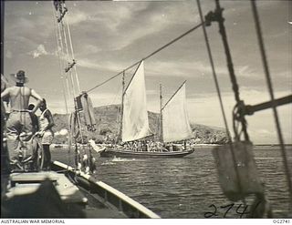 PORT MORESBY, PAPUA. C. 1944. MEMBERS OF THE RAAF RESCUE SERVICE UNITS ON BOARD THEIR VESSELS WATCHING A SWIMMING RACE IN PORT MORESBY HARBOUR