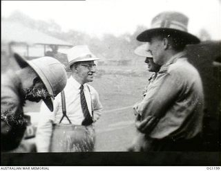 AITAPE, NORTH EAST NEW GUINEA. C. 1944-06. LEFT TO RIGHT: JOHN DEDMAN, THE MINISTER FOR WAR ORGANISATION OF INDUSTRY, ARTHUR DRAKEFORD, THE MINISTER FOR AIR, AIR COMMODORE F. R. W. SCHERGER, THE ..