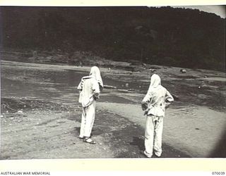 NADZAB, NEW GUINEA. 1944-01-12. ALONGSIDE 111TH CASUALTY CLEARING STATION APPROXIMATELY 10 MILES FROM NADZAB ALONG THE MARKHAM VALLEY HIGHWAY IS A LARGE WATER FILLED GRAVEL PIT FED BY A NEARBY ..