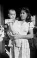 Guam, portrait of woman holding baby