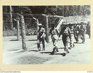 MALAHANG, NEW GUINEA. 1944-04-23. THE HONOURABLE E.J. WARD, MINISTER FOR EXTERNAL TERRITORIES IN THE AUSTRALIAN GOVERNMENT (1), ACCOMPANIED BY PP1 MAJOR-GENERAL B.M. MORRIS, DSO, GOC, AUSTRALIAN ..