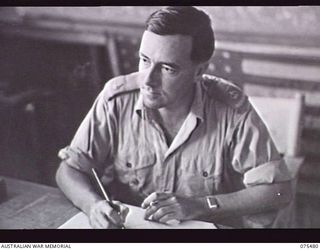 LAE, NEW GUINEA. 1944-08-27. MAJOR F H BUSS, HONARARY COMMISSIONER AND OFFICER IN CHARGE LAE BRANCH AUSTRALIAN COMFORTS FUND