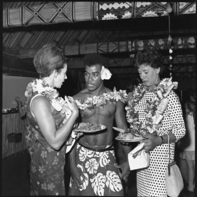 Miss Maglia, on right, and unidentified woman speaking with Fijian man, Suva, Fiji, 22 February 1966 [2] John Mulligan