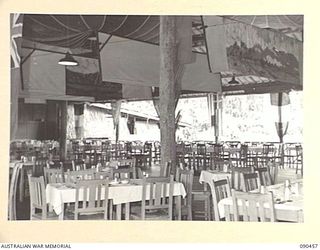 LAE, NEW GUINEA. 1945-04-08. THE INTERIOR OF THE OFFICERS CLUB, HEADQUARTERS FIRST ARMY, DURING THE VISIT OF SENATOR J.M. FRASER, ACTING MINISTER FOR THE ARMY, TO THE AREA