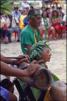 Ceremonial drummer and elderly woman, Sixth Festival of Pacific Arts.