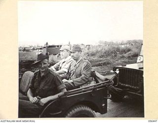 CAPE WOM, NEW GUINEA, 1945-09-13. JAPANESE STAFF OFFICERS ARRIVING IN AN AUSTRALIAN JEEP (DRIVER A.W. PORTER) FOR THE SURRENDER CEREMONY HELD AT CAPE WOM AIRSTRIP. LIEUTENANT-GENERAL H. ADACHI ..