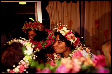 Women wearing 'ei upoko (head wreaths), Cook Islands
