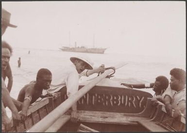 Solomon Islanders, aided by the Bishop, launching boat, Te Motu, Santa Cruz Group, Solomon Islands, 1906 / J.W. Beattie