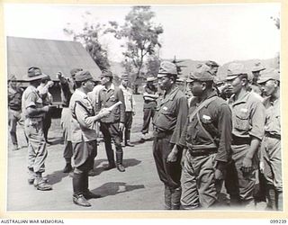 RABAUL, NEW BRITAIN, 1945-12-05. SUSPECTED JAPANESE WAR CRIMINALS WERE ROUNDED UP AND DETAINED IN A COMPOUND IN HQ 11 DIVISION AREA AND GUARDED BY TROOPS OF NEW GUINEA INFANTRY BATTALION. SHOWN, ..