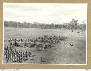 WONDECLA, QLD. 1944-04-15. GENERAL VIEW OF THE PARADE OF THE 2/1ST INFANTRY BATTALION ON THE HERBERTON RACECOURSE. TAKING THE PARADE IS NX163 LIEUTENANT COLONEL P.A. CULLEN, DSO. (ON HORSEBACK) ..