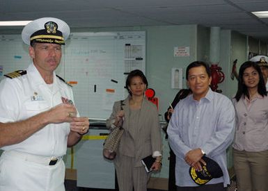 US Navy (USN) Captain (CAPT) Joseph L. Moore Commanding Officer, Medical Training Facility, aboard the USN Military Sealift Command (MSC), Hospital Ship, USNS MERCY (T-AH 19), provide a tour of the ship for Republic of the Philippines Consul General, The Honorable Ariel Abadilla and other distinguished guest, during a visit at Navy Base Pearl Harbor, Hawaii (HI). The USNS MERCY is starting a scheduled five-month deployment to deliver aid and humanitarian assistance to the Pacific Islands, and Southeast Asia