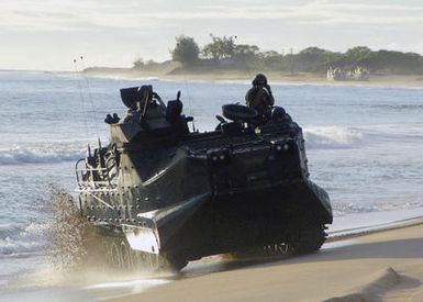 US Marine Corps (USMC) Marines assigned to the 3rd Amphibious Assault Battalion (AAB), Marine Corps Base (MCB) Camp Pendleton, California (CA), maneuver their AAV7A1 Assault Amphibian Vehicles around the beach during a training exercise at the Pacific Missile Range Facility (PMRF), Hawaii (HI)