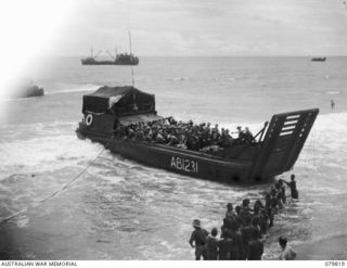 TOKO, BOUGAINVILLE, SOLOMON ISLANDS. 1945-03-20. AB1231 20 TON VESSEL OF THE 42ND LANDING CRAFT SECTION, ROYAL AUSTRALIAN ENGINEERS, (TRANSPORTATION SECTION, WATER TRANSPORT), CARRYING TROOPS OF ..