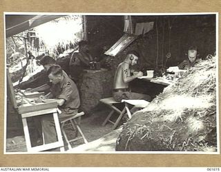 DUMPU, RAMU VALLEY, NEW GUINEA. 1943-11-29. SIGNAL OFFICE, HEADQUARTERS, 7TH AUSTRALIAN DIVISION. SHOWN ARE: QX4618 SERGEANT L. C. BROWN (1); VX34654 LANCE CORPORAL D. FISHER (2); VX21895 SIGNALMAN ..