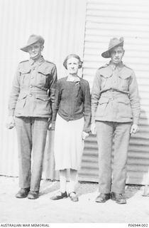 Portrait of brothers SX13497 Private (Pte) Cecil Walter Tee (left) and SX13498 Pte Thomas Austin Tee (right) with their mother. The brothers enlisted together on 30 June 1941 in Point Germain, SA, ..