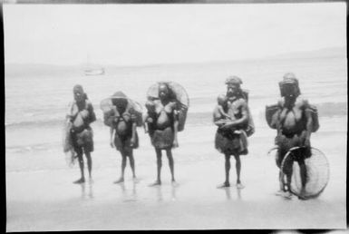 Five women with fishing baskets, Awar, Sepik River, New Guinea, 1935 / Sarah Chinnery