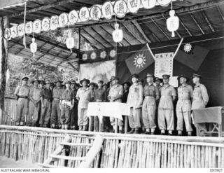 RABAUL, NEW BRITAIN. 1945-10-10. A SPECIAL PARADE AND CONCERT WAS HELD AT THE CAMP TO CELEBRATE THE 34TH ANNIVERSARY OF THE FOUNDING OF THE CHINESE REPUBLIC. MAJOR GENERAL K.W. EATHER, GENERAL ..