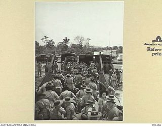 LAE, NEW GUINEA, 1945-05-07. AWAS DISEMBARKING FROM A LANDING BARGE ON THE BEACH AT MILFORD HAVEN. THEY ARE PART OF A GROUP OF 342 AWAS FROM AUSTRALIA WHO ARE EN ROUTE TO THE AWAS BARRACKS AT ..