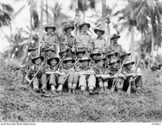 MADANG, NEW GUINEA. 1944-07-03. PERSONNEL OF NO. 6 PLATOON, HEADQUARTERS COMPANY, 24TH INFANTRY BATTALION. IDENTIFIED PERSONNEL ARE:- VX104495 CORPORAL K.D. PARKER (1); VX131867 CORPORAL C.J.E. ..