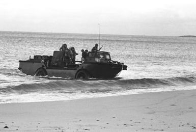 Navy beachmasters come ashore at Makua Valley Beach aboard an amphibious resupply cargo lighter (LARC V) during Operation KERNEL BLITZ