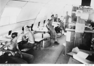 Torokina, Bougainville. c. 1945-07. At the base used by No. 1 and No. 3 Section, Detached, 2 Field Survey Company. Interior of the Drawing Offices, which are Nissen Huts taken over from the US ..