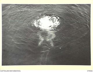 KALUMALAGI RIVER, NEW BRITAIN. 1945-02-12. A DIVER OF THE 17TH FIELD COMPANY, WORKING UNDER WATER DURING THE CONSTRUCTION OF A 30 TON BARGE SLIPWAY NEAR THE MOUTH OF THE RIVER