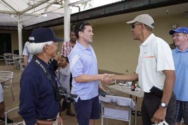 Barack Obama greets military personnel before playing golf in Kaneohe Bay, Hawaii, December 24, 2014
