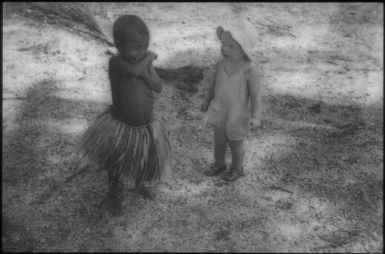 Two children making friends : Mapamoiwa Station, D'Entrecasteaux Islands, Papua New Guinea, 1956-1959 / Terence and Margaret Spencer