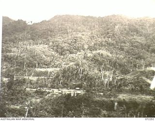 YAULA, NEW GUINEA. 1944-04-10. MABELEBU VILLAGE VIEWED FROM A MOUNTAIN ABOVE KOFEBI RIVER. TWO DAYS EARLIER THE AREA WAS THE SCENE OF BITTER FIGHTING WHEN A COMPANY FROM THE 57/60TH INFANTRY ..