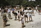 French Polynesia, school children exercising outdoors on Tahiti Island