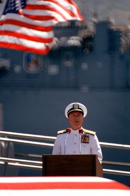 Admiral Sylvester R. Foley Jr., commander-in-chief of the Pacific Fleet, speaks at a ceremony honoring the Unknown Serviceman of the Vietnam Era. The serviceman's casket will be transported aboard the frigate USS BREWTON (FF 1086) to Alameda, California, and then transferred to Arlington National Cemetery for interment at the Tomb of the Unknowns