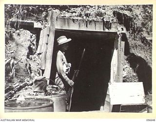 RABAUL, NEW BRITAIN. 1945-09-15. FOLLOWING THE SURRENDER OF THE JAPANESE, TROOPS OF HEADQUARTERS 11 DIVISION OCCUPIED THE RABAUL AREA. OWING TO DESTRUCTION BY ALLIED AIR ATTACK OF ALL ABOVEGROUND ..