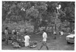 Groups with baskets of breadfruit?