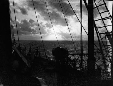 [People on cruise ship overlooking seascape]