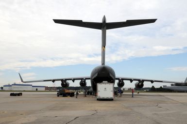 Earthquake ^ Flooding ^ Tsunami - Atlanta, Ga. , October 2, 2009 -- At Dobbins Air Force Base, this portable Logistics Incident Command Base(LICB) is being loaded aboard a C-17 cargo plane. Approximately 30 FEMA Logistics (LOG) staff and equipment depart today for Hickam Air Force Base, Hawaii to set up logistical assistance in response to the recent Samoan devastating tsunami. George Armstrong/FEMA