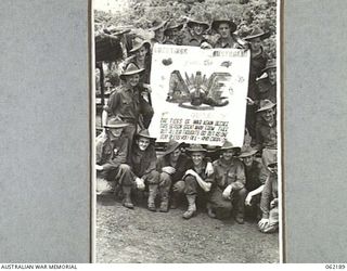 DUMPU, NEW GUINEA. 1943-12-10. AUSTRALIAN IMPERIAL FORCE TROOPS IN NEW GUINEA CONVEYING THEIR CHRISTMAS GREETINGS TO ALL THE FOLKS AT HOME