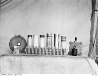 FINSCHHAFEN - SIO AREA, NEW GUINEA. 1944-03-31. JAPANESE AMMUNITION COLLECTED FROM DUMPS IN THE AREA BY THE CHIEF ENGINEER'S BRANCH, HEADQUARTERS 2ND AUSTRALIAN CORPS. THE AMMUNITION DISPLAYED, ..