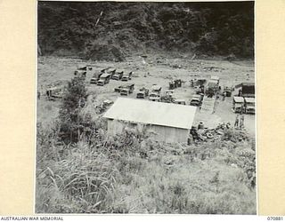 LITTLE EDIE CREEK, NEW GUINEA, 1944-02-25. KIANDI WORKSHOPS DETACHMENT WITH VEHICLES OF THE 2/34TH GENERAL TRANSPORT COMPANY UNDERGOING MAINTENANCE AND REPAIR