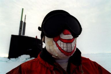 U.S. Navy Sonar Technician Second Class Daniel Bergman wears protective headgear while exploring the harsh arctic environment of the North pole. The U.S. Navys attack submarine USS POGY (SSN 647) returned to Hawaii, on Tuesday, November 12, after a 45-day research mission to the North Pole. The second of five planned deployments through the year 2000, USS POGY embarked a team of researchers led by Mr. Ray Sambrotto of Columbia University. During the several thousand mile trek, the submarine collected data on the chemical, biological, and physical properties of the Arctic Ocean, and conducted experiments in geophysics, ice mechanics, pollution detection, and other areas. For the purposes...