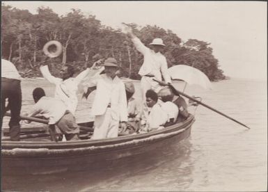 Bishop Wilson and Southern Cross passengers on rowboat farewelling Mara-na-tabu, Solomon Islands, 1906, 2 / J.W. Beattie