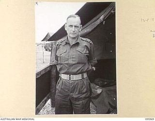 CAPE WOM, WEWAK AREA, NEW GUINEA. 1945-08-31. LIEUTENANT COLONEL C.R. THOMSON, ASSISTANT DIRECTOR OF ORDNANCE SERVICE, HEADQUARTERS ROYAL AUSTRALIAN ENGINEERS 6 DIVISION