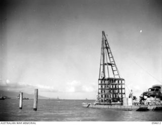 MILNE BAY, NEW GUINEA, 1943-07-11. LARGE PILE-DRIVER IMPROVISED BY THE TROOPS OF THE 4TH AUSTRALIAN FIELD COMPANY, ROYAL AUSTRALIAN ENGINEERS, FOR THE CONSTRUCTION OF THE NEW 960 FEET "T" JETTY. ..