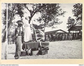 DALLMAN HARBOUR, NEW GUINEA. 1945-11-04. CHAPLAIN R.R. HARLEY CONDUCTING A MEMORIAL SERVICE OF THANKSGIVING FOR VICTORY AND REMEMBRANCE FOR MEMBERS OF 2/3 INFANTRY BATTALION WHO FELL IN THE ..