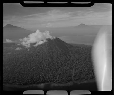 Mt Lolobau, 3058 feet high, Mt Ulawun (Father), 7376 feet high and Mt Bamus (South Son), 7546 feet high, New Britain, Papua New Guinea