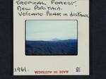 Tropical forest, volcano peak in distance, New Britain, [Papua New Guinea], 1961